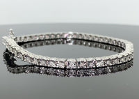 
              .35 CARAT REAL DIAMONDS STERLING SILVER RHODIUM FANOOK REAL DIAMOND 1 ROW LINK TENNIS BRACELET - 7.25 INCHES
            